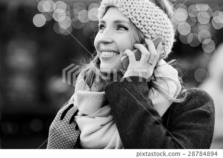 Dreaming woman in winter city a festive mood Dreaming woman in winter city a festive mood 28784894