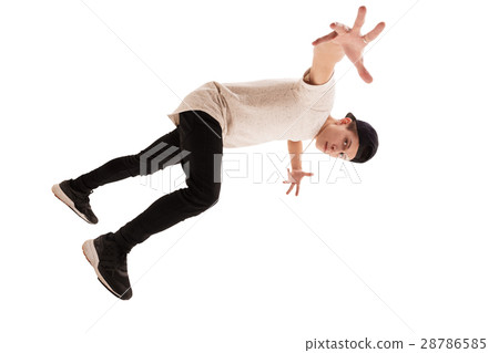 Young handsome rap dancer in baseball cap jumping Young handsome rap dancer in baseball cap jumping 28786585