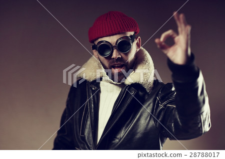 man in winter clothes shows sign ok, polar explorer, aviator - portrait 28788017
