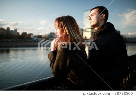 young couple at the park in winter view from the back young couple at the park in winter view from the back 28788500