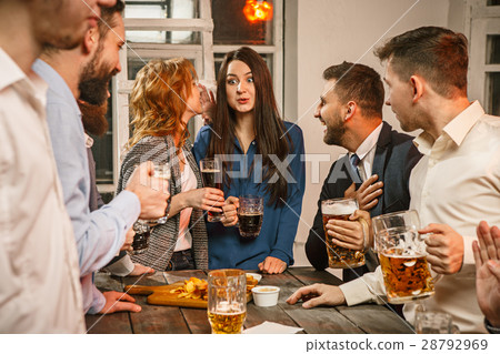 Group of friends enjoying evening drinks with beer 28792969