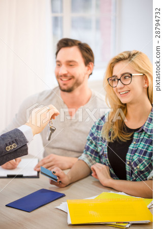 Manager giving key to couple Manager giving key to couple 28794732