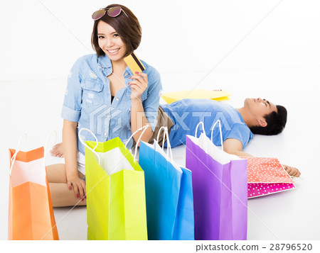 young Couple with shopping bags and credit card young Couple with shopping bags and credit card 28796520