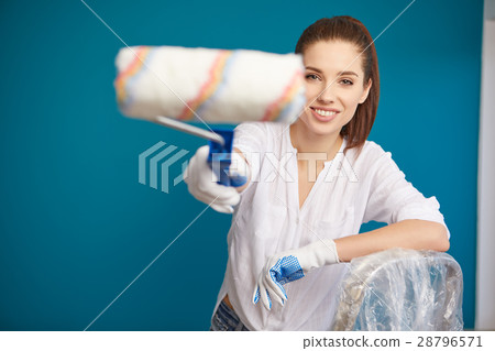bright picture of lovely housewife painting  home 28796571