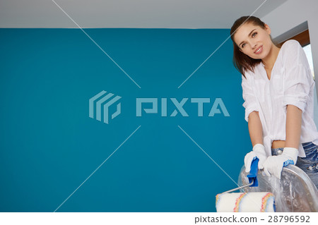 woman paint on the wall. Home renovation concept 28796592