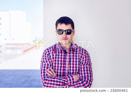 Man against a wall, serious look, self concept. In Man against a wall, serious look, self concept. In 28800461