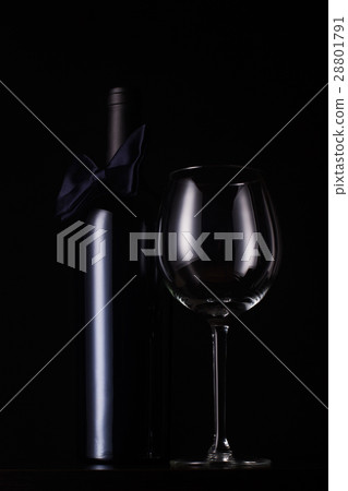 black red wine bottle with empty tall glass 28801791