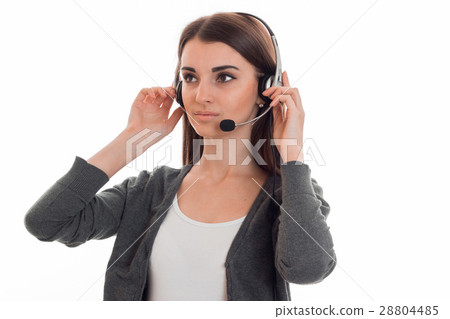 young serious girl in headphones keeps their hands young serious girl in headphones keeps their hands 28804485