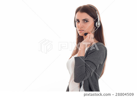 serious young girl in headphones looks away and serious young girl in headphones looks away and 28804509