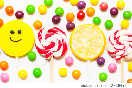 Lollipops, candy smile on, scattered round pills Lollipops, candy smile on, scattered round pills 28804513