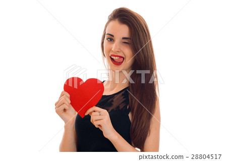 beautiful girl with red lipstick on lips holding a beautiful girl with red lipstick on lips holding a 28804517