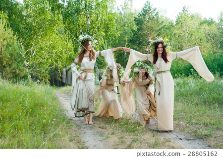 Beautiful women with flower wreath play game 28805162