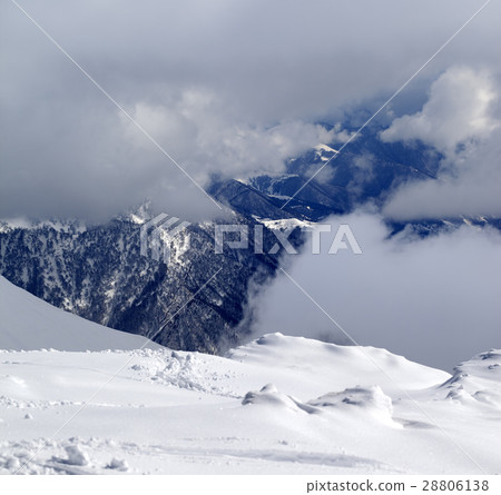 View on winter snowy mountains in clouds 28806138