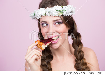 young model with bright flowers on her head 28806203