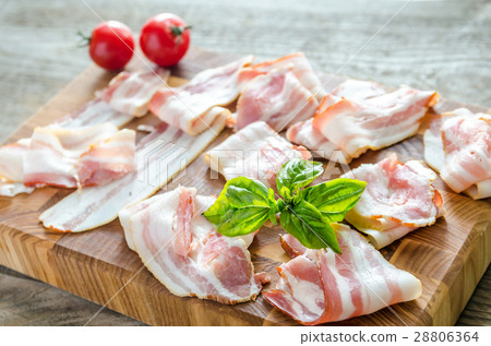bacon strips on wooden board 28806364