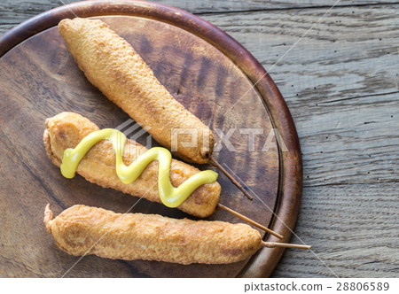 Corn dogs on the wooden board 28806589