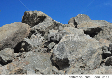 granite stones on a background of blue sky 28810544