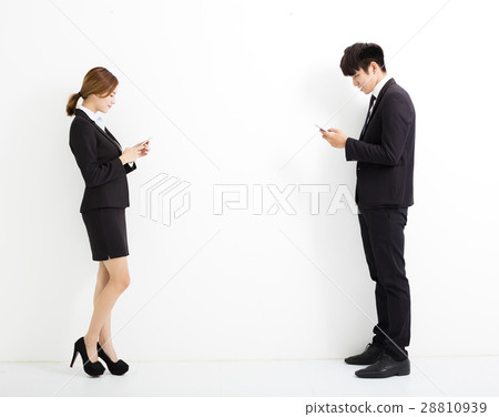 young business man and woman holding smart phone 28810939
