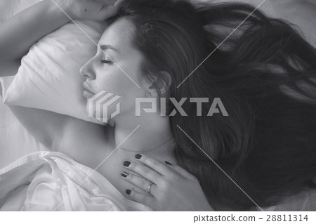 young woman in bed, pillow, blanket, sleeping 28811314