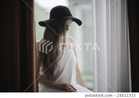 beautiful brunette in hat 28811315