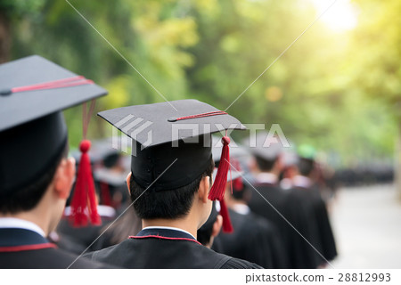 Back of graduate during commencement at university Back of graduate during commencement at university 28812993