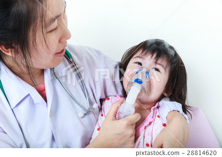 Asian child have respiratory illness with inhaler Asian child have respiratory illness with inhaler 28814620