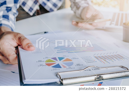 Businessman discussing the analysis charts Businessman discussing the analysis charts 28815372