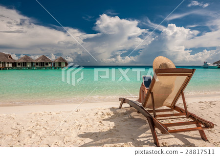 Young woman with tablet pc at the beach 28817511