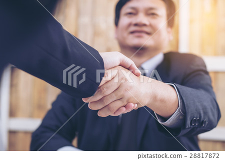 Businessmen handshake after successful negotiations. 28817872
