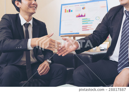 Businessmen handshake after successful negotiations. Businessmen handshake after successful negotiations. 28817887