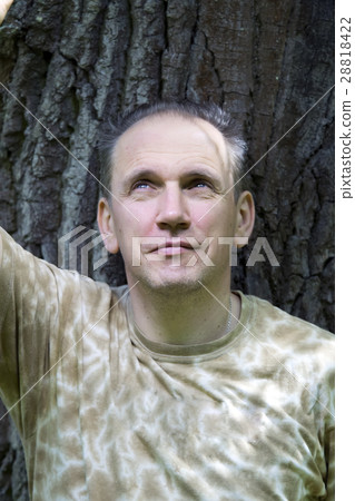 mature man portrait on a background of bark of a mature man portrait on a background of bark of a 28818422