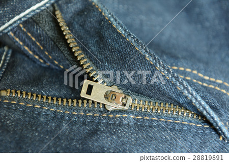 brass zipper of old blue denim jeans 28819891