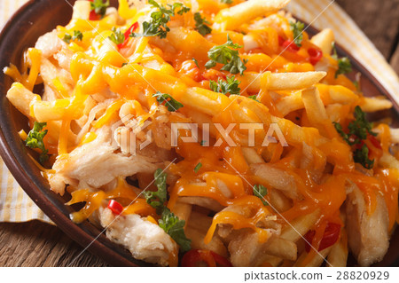 Spicy french fries with cheddar cheese 28820929