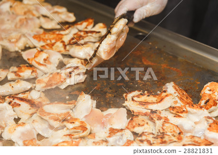 Hands of man take cooking of chicken meat 28821831
