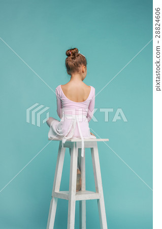 The little balerina dancer on blue background The little balerina dancer on blue background 28824606