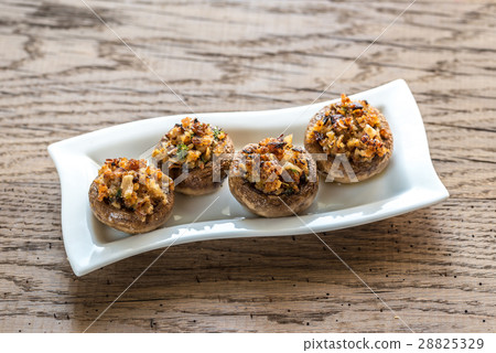 Mushrooms' caps stuffed with cheese and breadcrum Mushrooms' caps stuffed with cheese and breadcrum 28825329