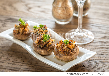 Mushrooms' caps stuffed with cheese and breadcrum 28825330