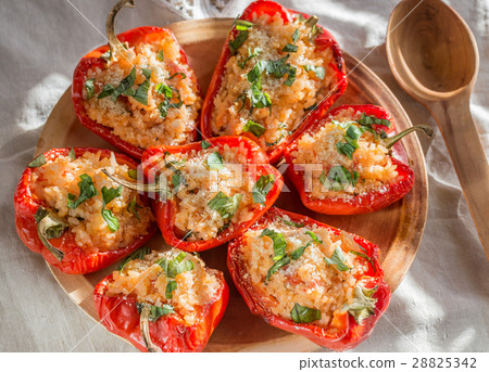 Stuffed red bell peppers with rice and cheese 28825342