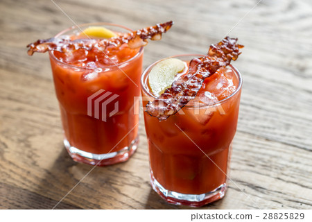 Two glasses of Bloody Mary with bacon rashers Two glasses of Bloody Mary with bacon rashers 28825829