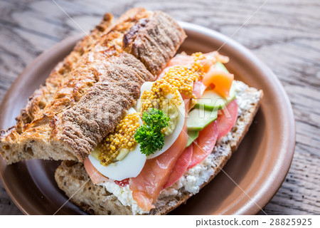 Sandwich with salmon, avocado and eggs Sandwich with salmon, avocado and eggs 28825925