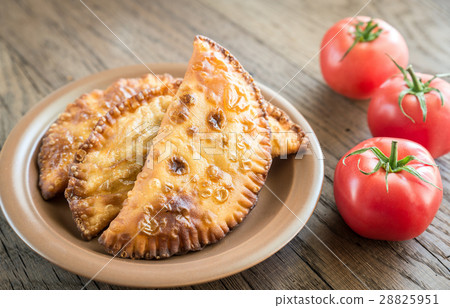 Meat Patties on the wooden background 28825951