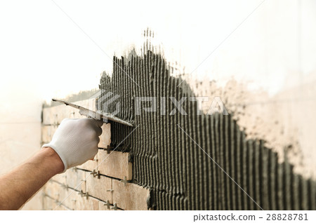 Installing the tiles on the wall. Installing the tiles on the wall. 28828781