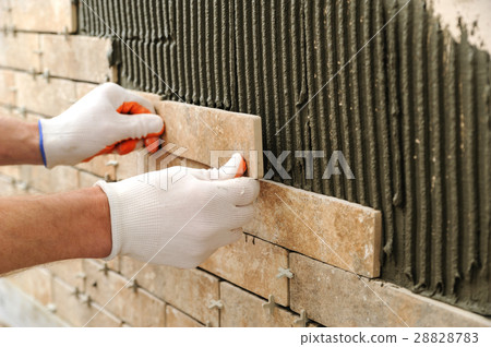 Installing the tiles on the wall. Installing the tiles on the wall. 28828783