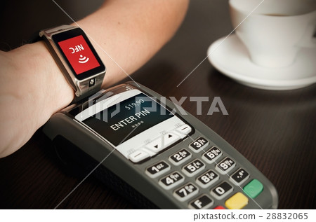 Man making payment through smartwatch via NFC 28832065