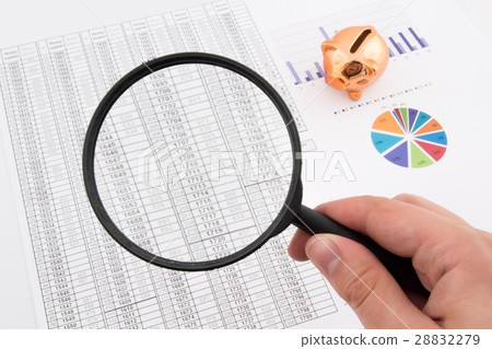 Magnifier on business background. Magnifier on business background. 28832279
