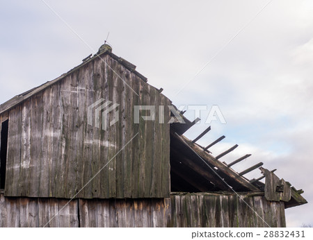 old destroyed barn against blue sky old destroyed barn against blue sky 28832431