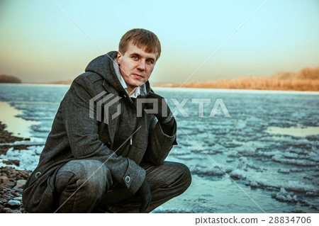 guy winter at the river 28834706