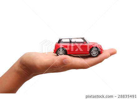 woman hand holding a toy car. business concept 28835491