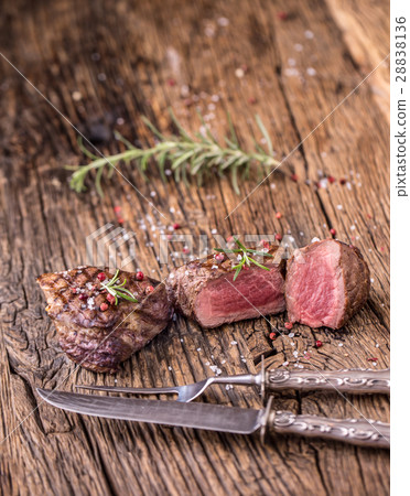 Grilled beef steak with rosemary, salt and pepper. 28838136