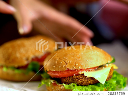 Hamburger fast food with ham on wooden board Hamburger fast food with ham on wooden board 28838769